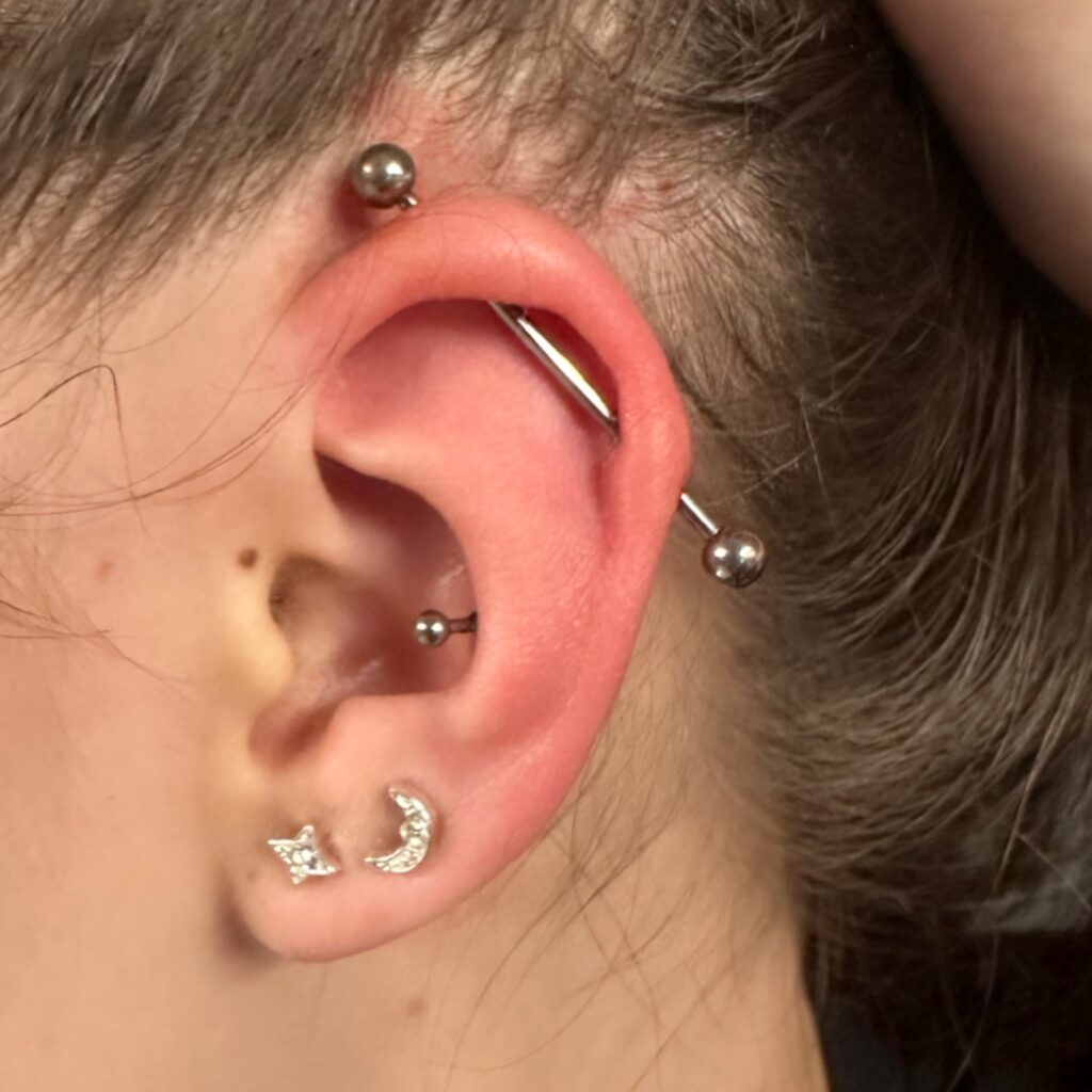 Conch piercing outliers ink birmingham piercing studio