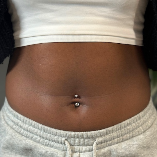 Belly button piercing woman Outliers Ink Piercing Studio birmingham